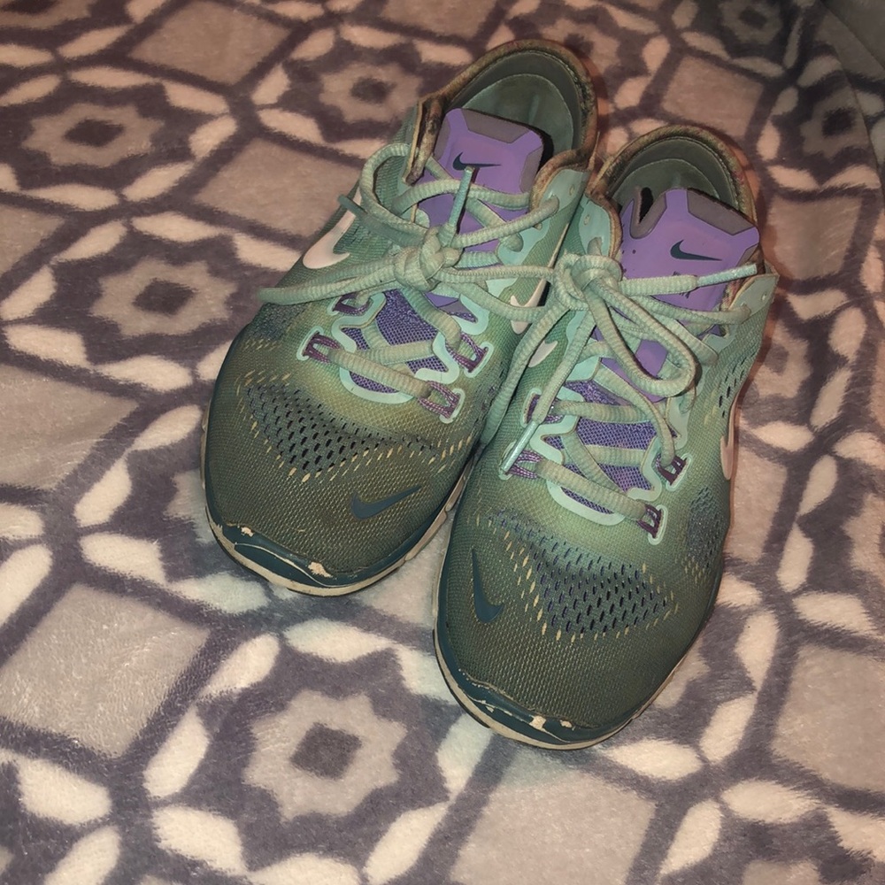 Blue and purple Nike shoes